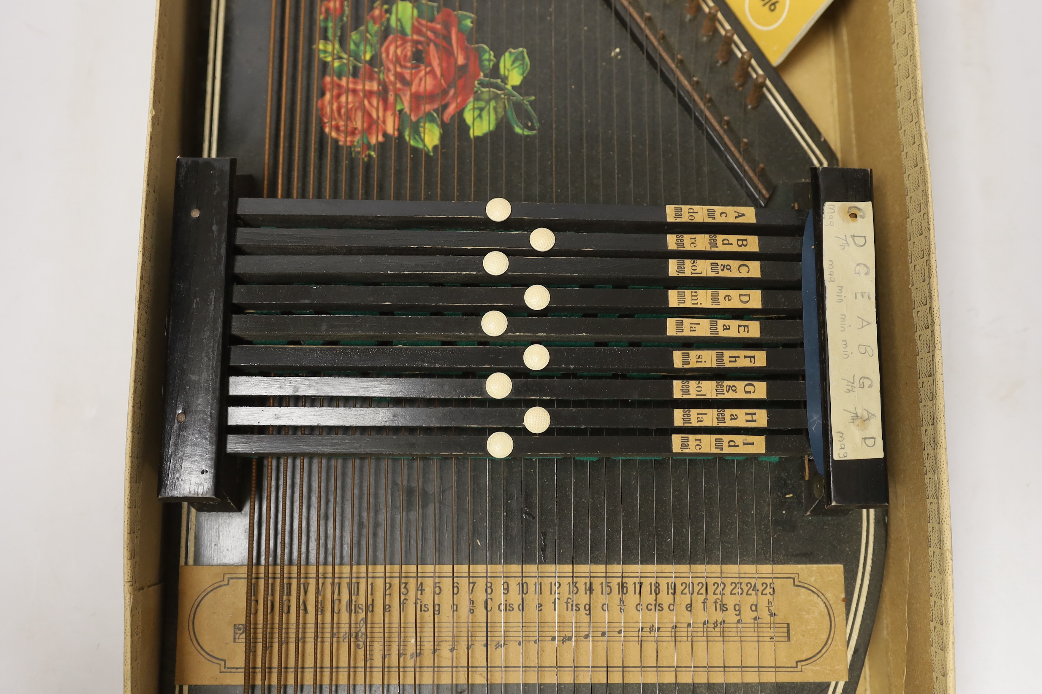 An autoharp in original box with booklet